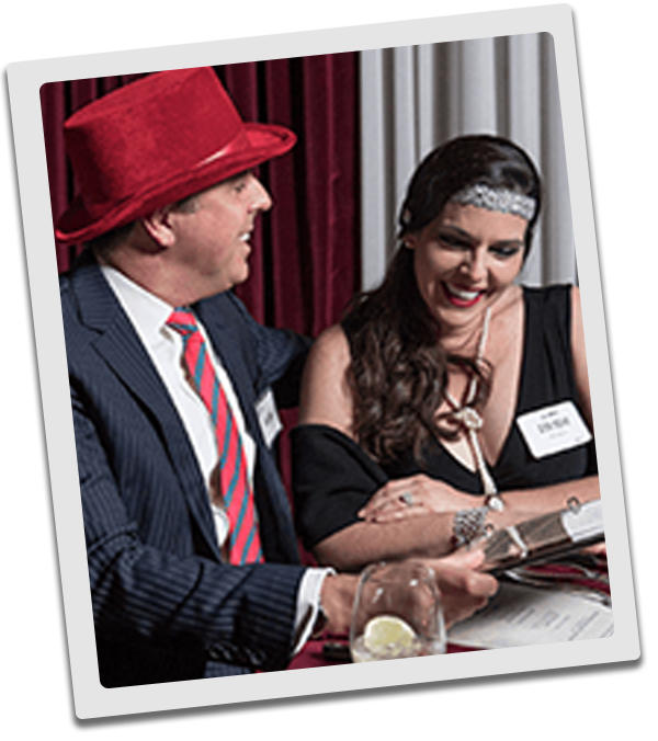 New Orleans Murder Mystery couple checking out the dinner menu